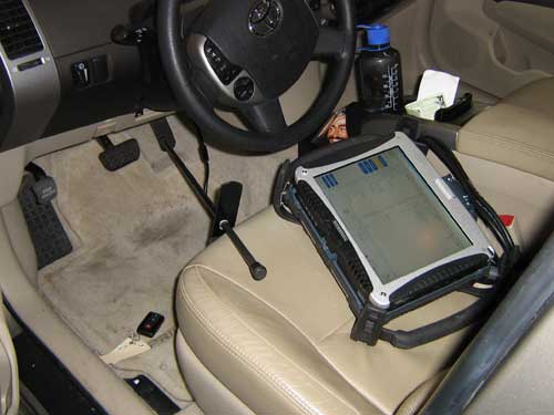 Toyota techstream scanner sitting on Prius driver's seat