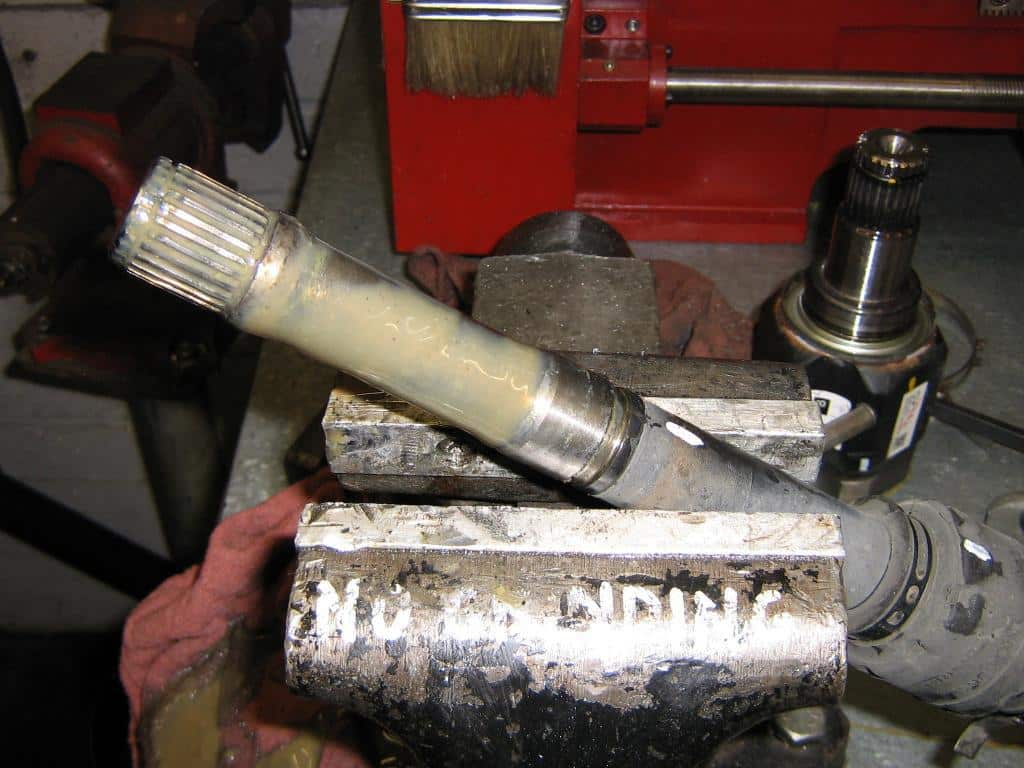 Axle with CV joint removed from inner end