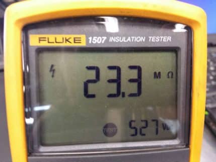 Insulation test meter screen reading 23.3 megohms