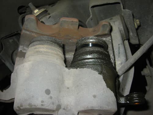 leaking brake caliper with piston hyper-extended