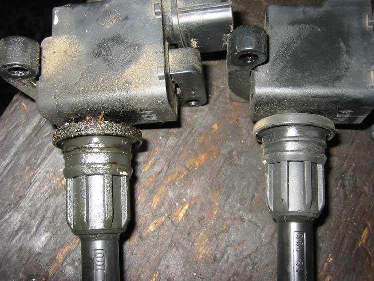 Two ignition coils. One is oily