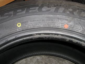 Tire sidewall with red dot and yellow dot