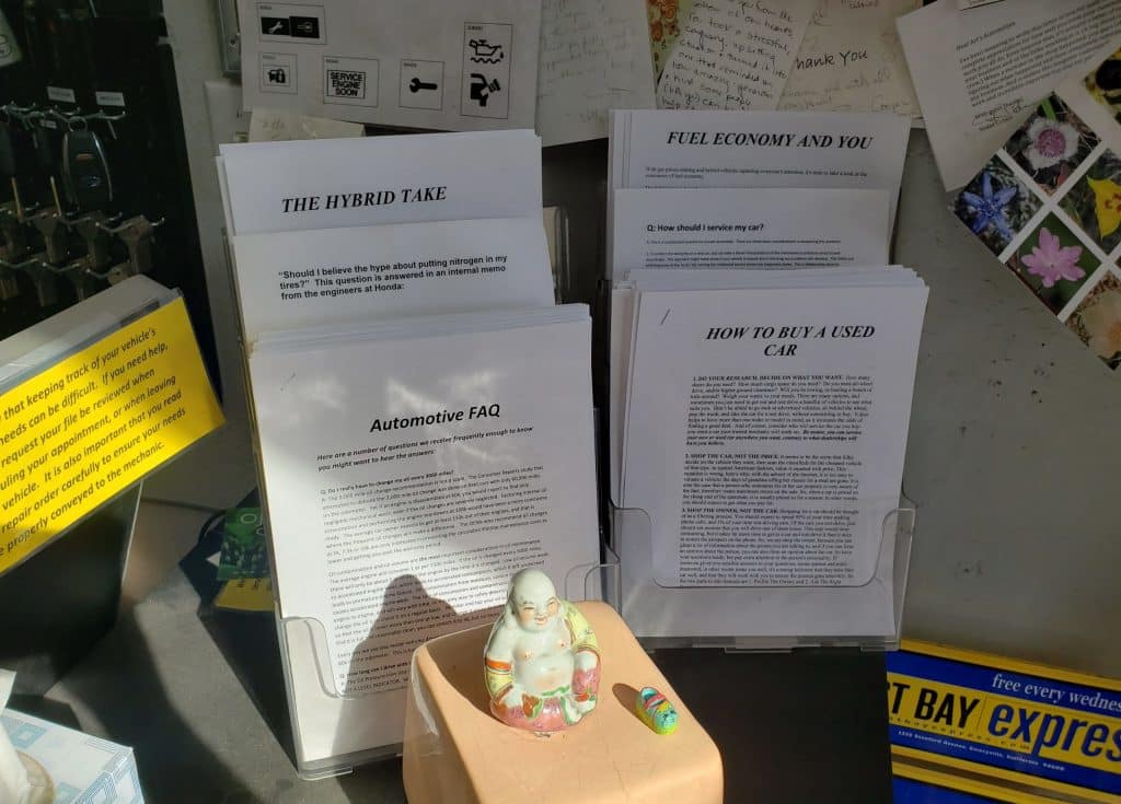 Car repair handouts sitting on Art's Automotive counter in Berkeley