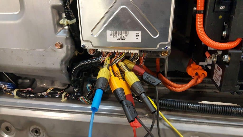 oscilloscope probes being used for electrical car diagnosis