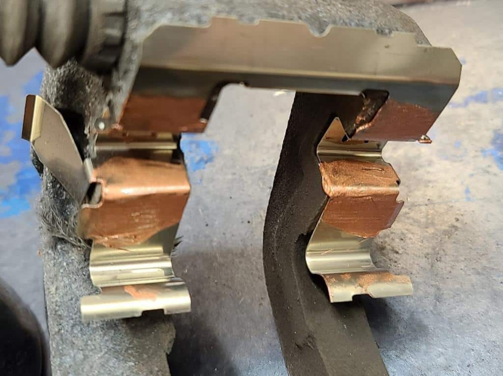 caliper bracket slider with copper grease applied