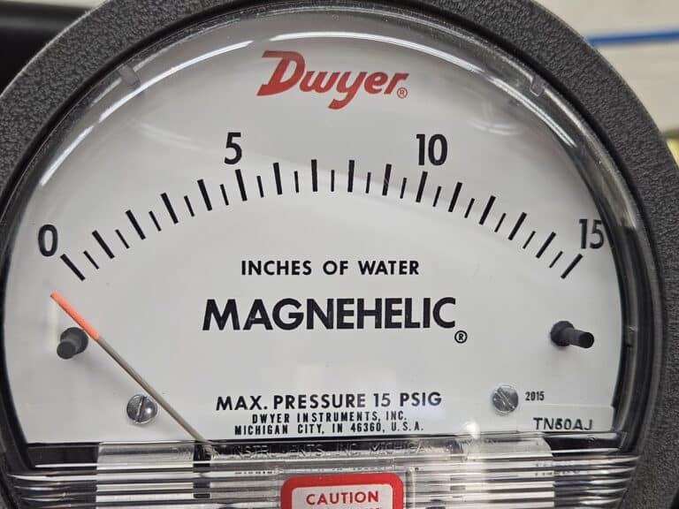 A close up view of a low pressure gauge
