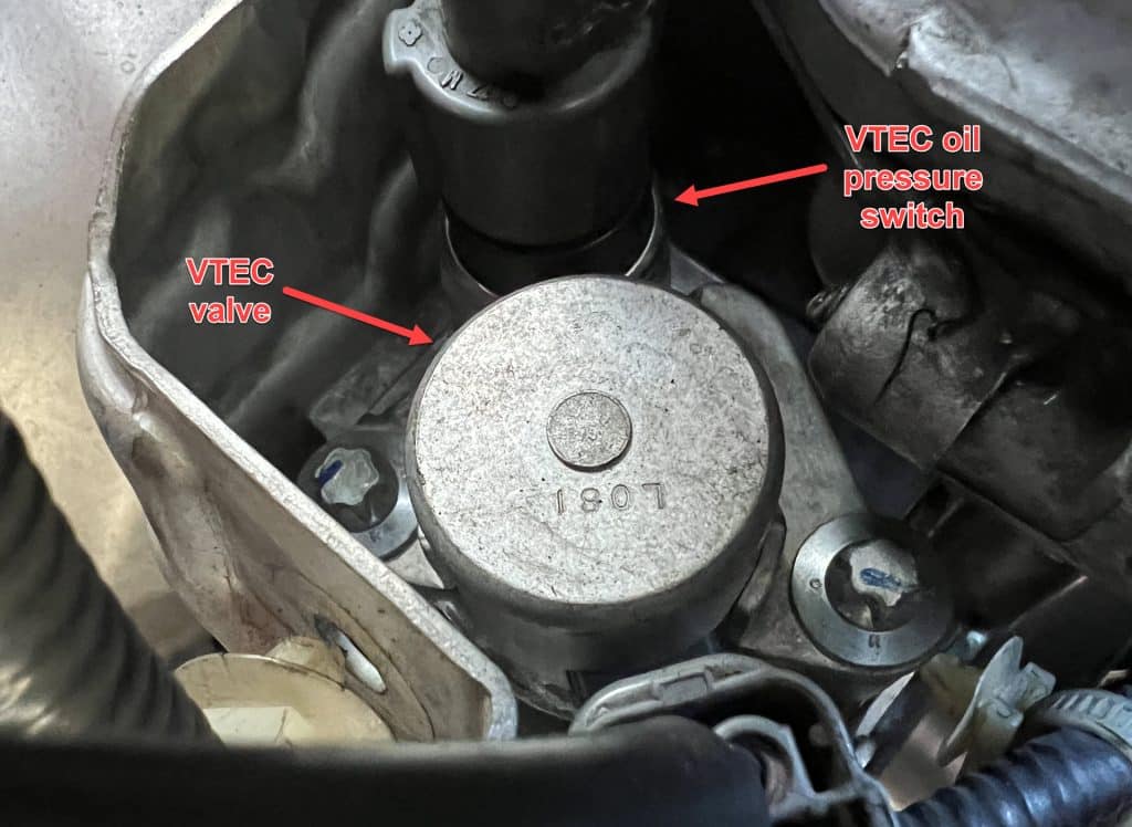 VTEC oil pressure switch and VTECH solenoid with arrows and labels for P2647 Honda article.