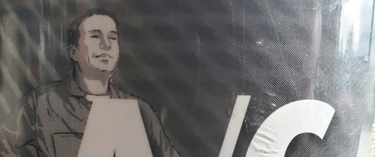 A close up of a proud man on a can of DIY A/C refrigerant.