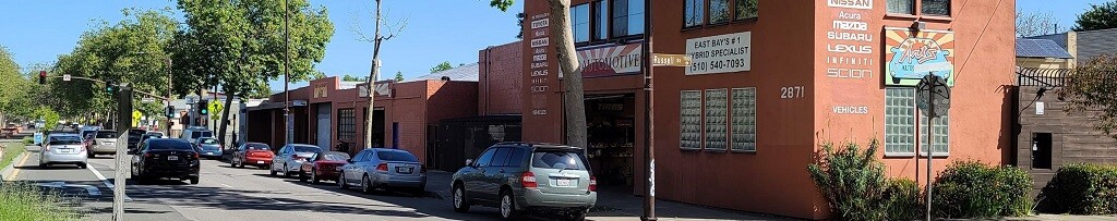 A picture of the four buildings that make up Art's Automotive spanning half a block