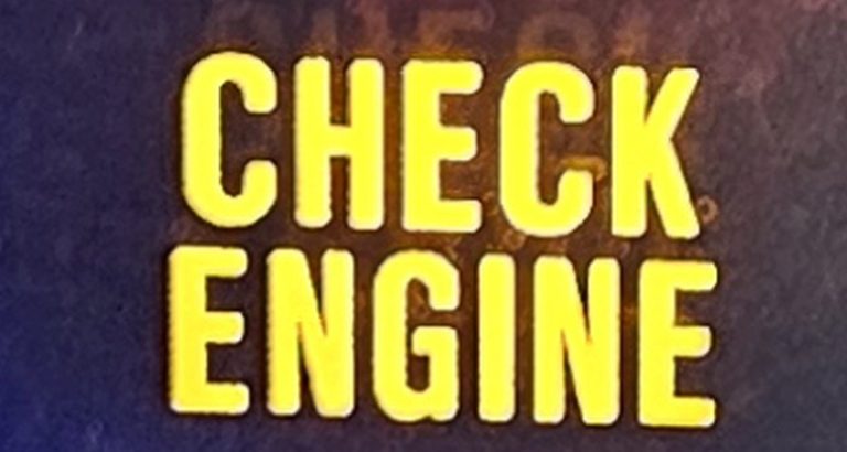 A close up of a check engine light