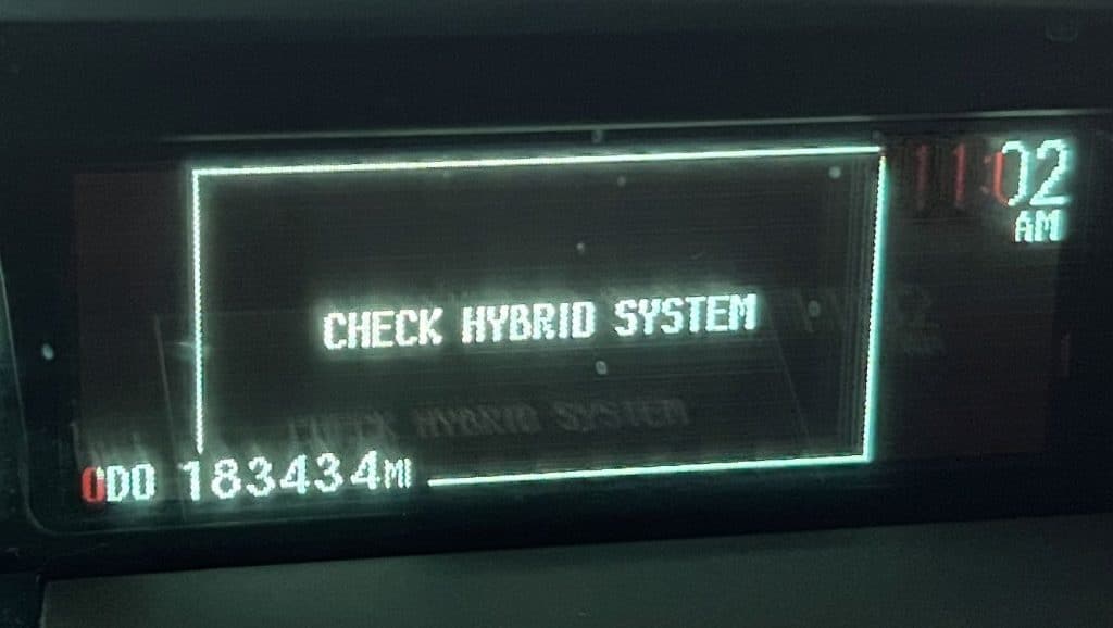 Check hybrid system displayed in green LEDs on a Toyota Prius dashboard.