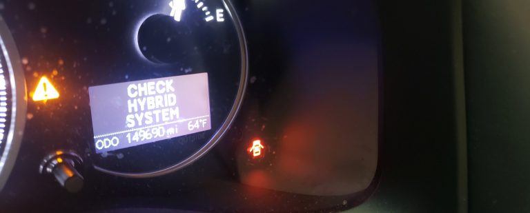 A check hybrid system warning on a dash