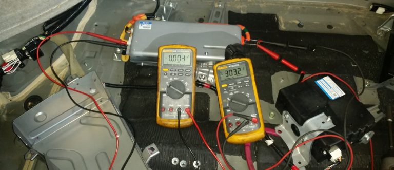 Two voltmeters taking measurements on a DC-DC converter.