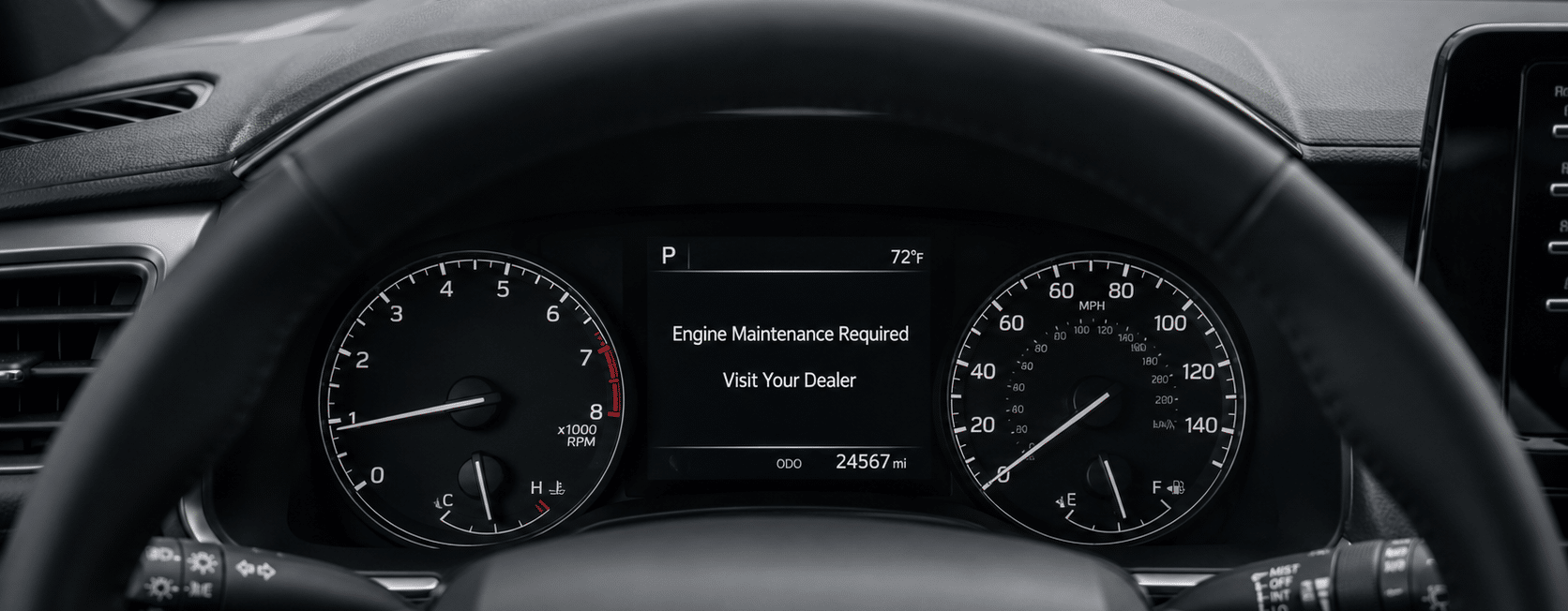 Toyota dashboard displaying “Engine Maintenance Required — Visit Your Dealer”