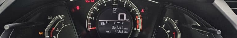 An image of an illuminated Honda Civic dashboard.