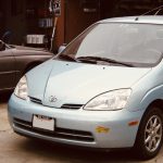 A first generation Prius hybrid parked in the yard after repair at Art's Automotive in Berkeley.