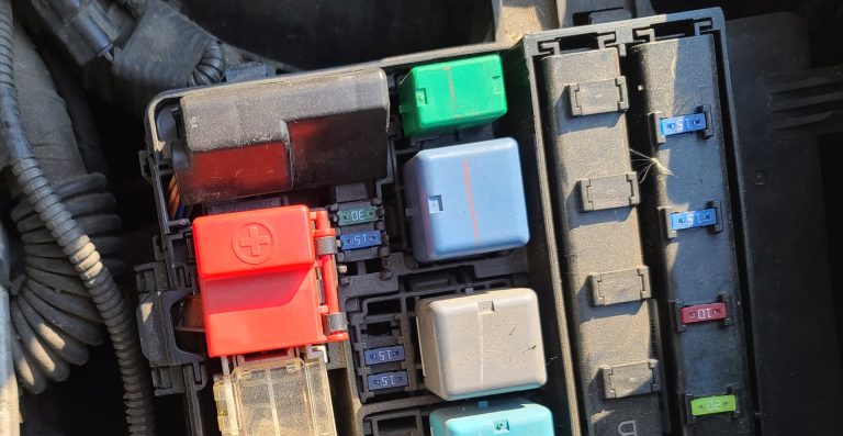 The jump start port cover for the 2004-2009 Prius