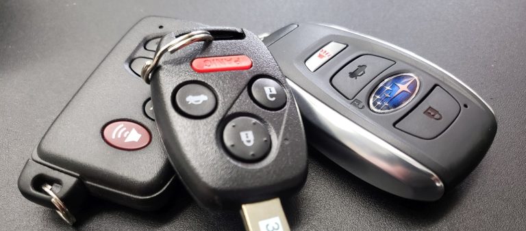 Keys for Toyota, Honda, and Subaru sitting on a counter