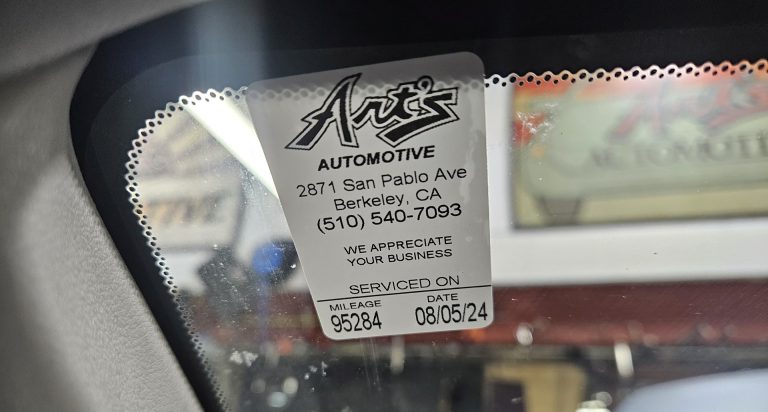 A lube sticker on a windshield.