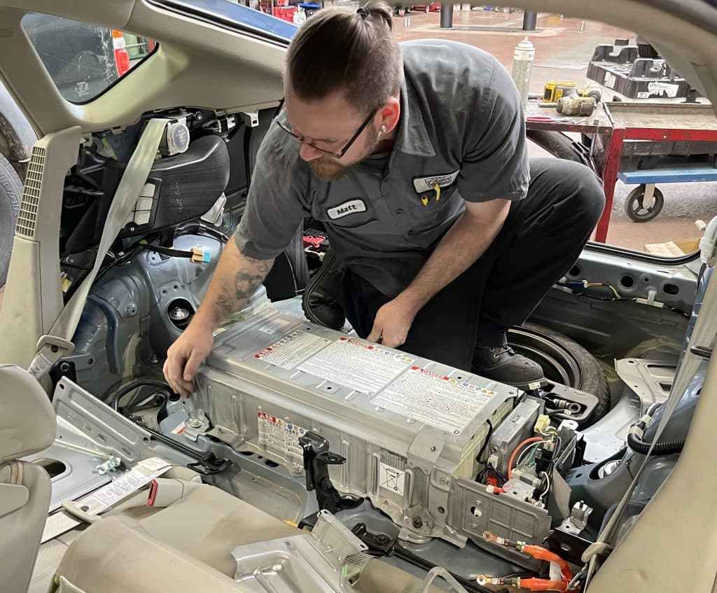 Matt removing a high voltage hybrid battery pack from a 2008 Prius.