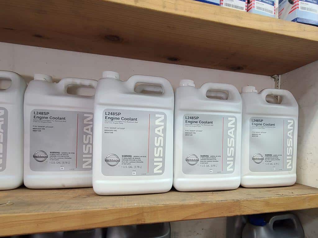 genuine Nissan coolant in gallon bottles on a shelf