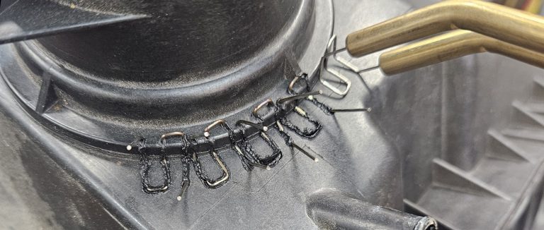 A hot staple gun used plastic repair on an air filter housing.