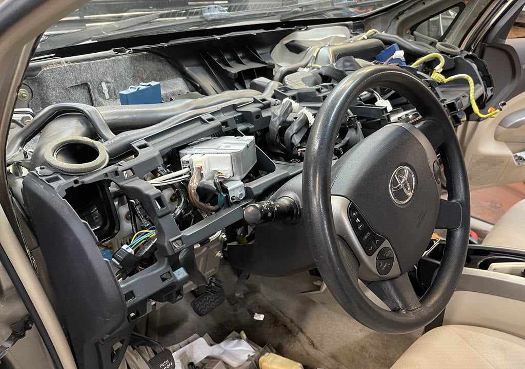 Prius dashboard disassembled to remove combination meter for repair