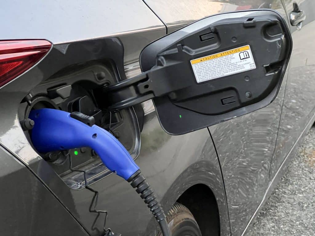 Close up of a Plug-in Prius Prime being charged.