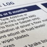 Close up of a Toyota scheduled maintenance guide book.