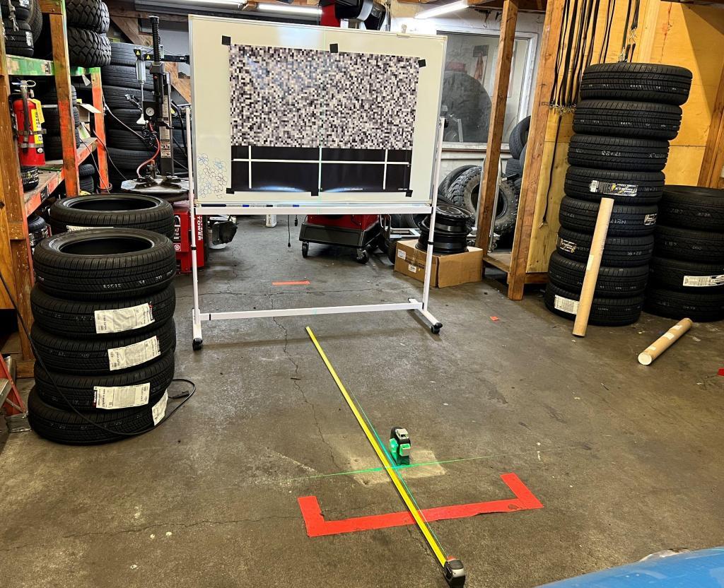 A Subaru EyeSight camera aiming target in use for ADAS calibration