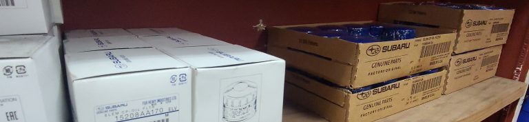 Boxes of Subaru oil filters sitting on a shelf at the Berkeley Subaru mechanic shop Art's Automotive waiting for the next Subaru service to arrive.