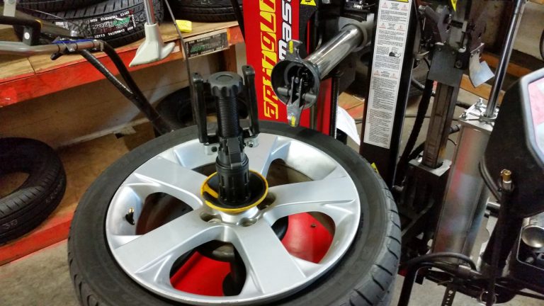 A tire being removed from a rim for repair.
