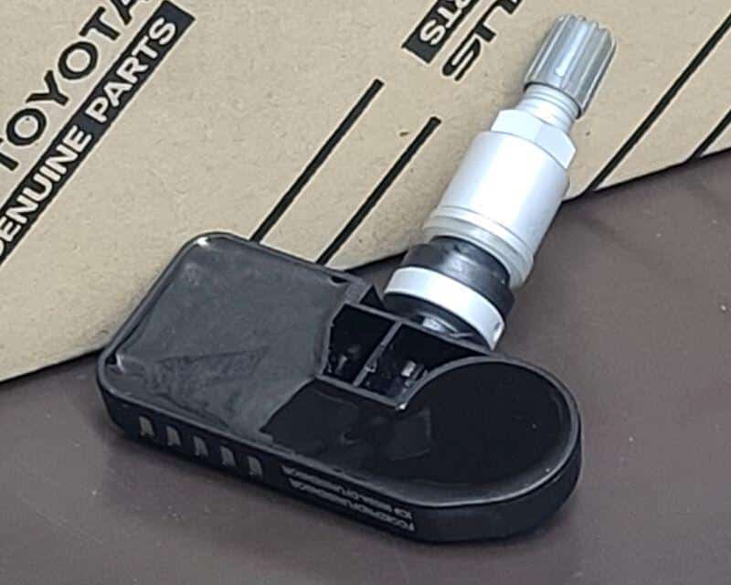 tire pressure warning system sensor sitting on a table