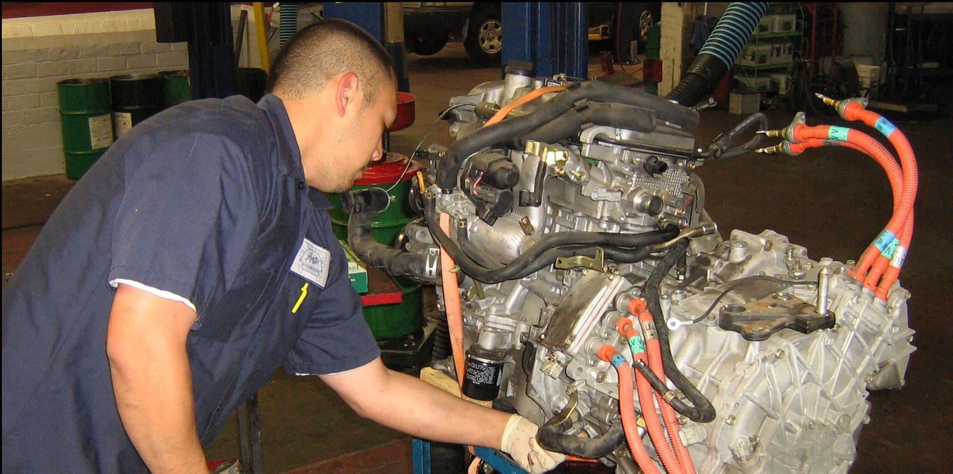An old picture of Scott repairing an old Prius back in the early 2000s