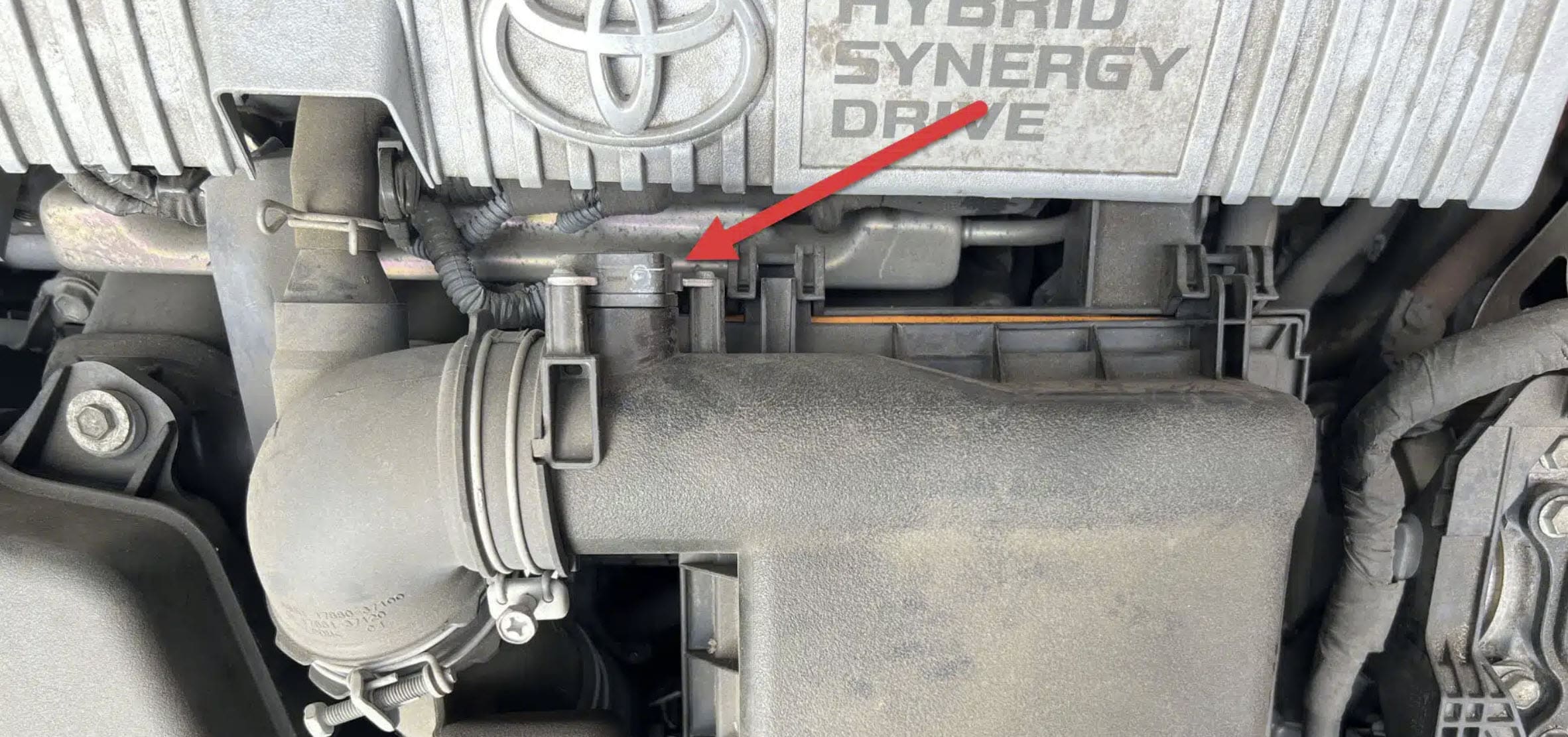 Image of a Prius engine with an arrow pointing to the MAF sensor.