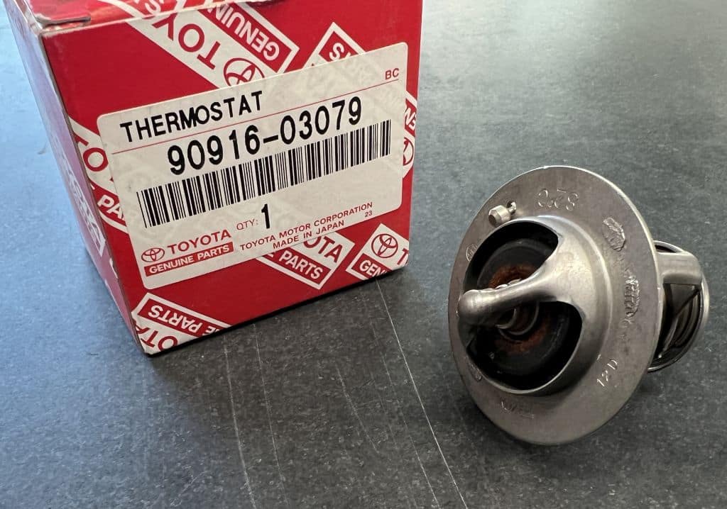 A Toyota thermostat sitting on a counter.